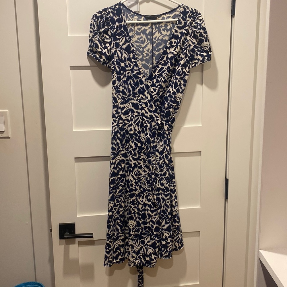 White and navy print wrap dress.